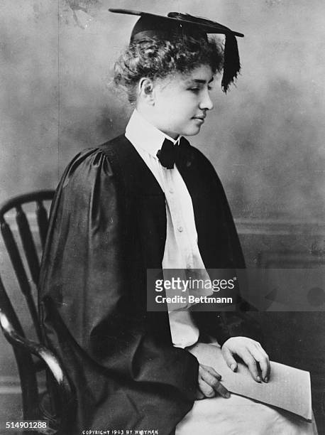 Helen Keller, recent graduate, Cum Laude, from Radcliffe College, wears her mortarboard and graduation gown.