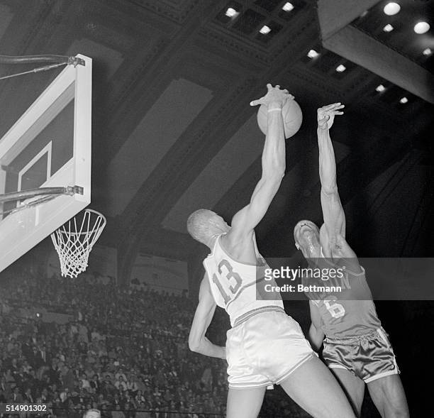 Philadelphia, Pennsylvania: A summit meeting between two big boys in the basketball business as Wilt Chamberlain of the Warriors and Bill Russell of...