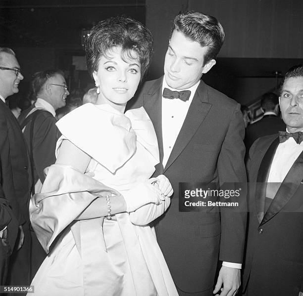 Beverly Hills, California- Joan Collins and Warren Beatty as they attended the Golden Awards dinner at the Coconut Grove in Beverly Hills.
