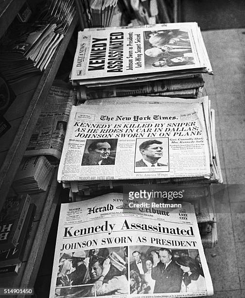 New York, New York: Headlines announcing Kennedy's assassination from three New York newspapers, the Times, the Daily News, and the Herald Tribune....
