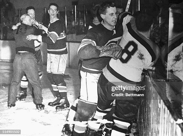 Photo shows a corner of the battlefield in Boston Garden during the bloody third period of the game between the Montreal Canadiens and the Boston...