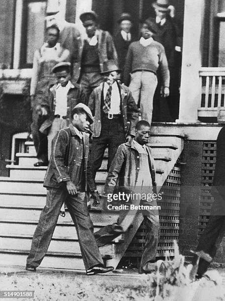 This photograph shows the seven defendants in the "Scottsboro Case" now being tried in Decatur, Alabama, as they left the Morgan County Jail there...