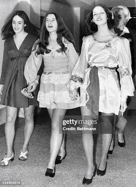 Trio of suspects in the Sharon Tate murder case sing as they march to court for a hearing. Left to right: Susan Atkins, Patricia Krenwinkel and...