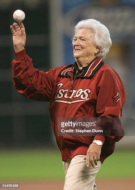 Former first lady Barbara Bush throws out the first pitch before game four of National League Championship Series between the St. Louis Cardinals and...