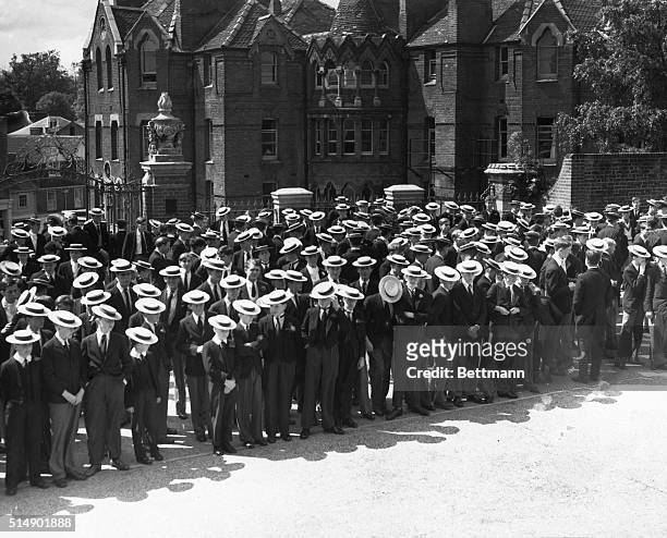 Students of Harrow School, England, assembled for roll call in front of school.