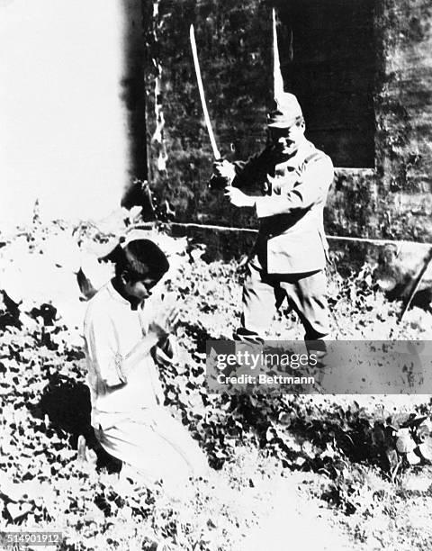 Chinese boy is beheaded - his only crime was being a member of a household suspected by Japs of aiding Chinese guerillas