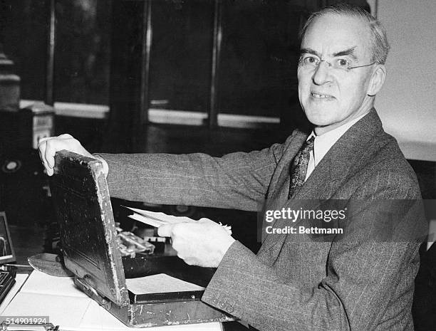 Sir Stafford Cripps, Chancellor of the British Exchequer, with his budget box, the secrets it contains will be revealed April 18th, when the...
