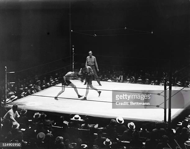 World light heavyweight champion Tommy Loughran boxing against James Braddock at Yankee Stadium.