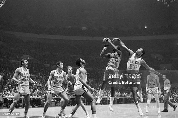 The N.Y. Knicks' ageless Dick Barnett , who led the Knicks to a whopping 107-88 victory over the Baltimore Bullets with 29 points April 9, guards...