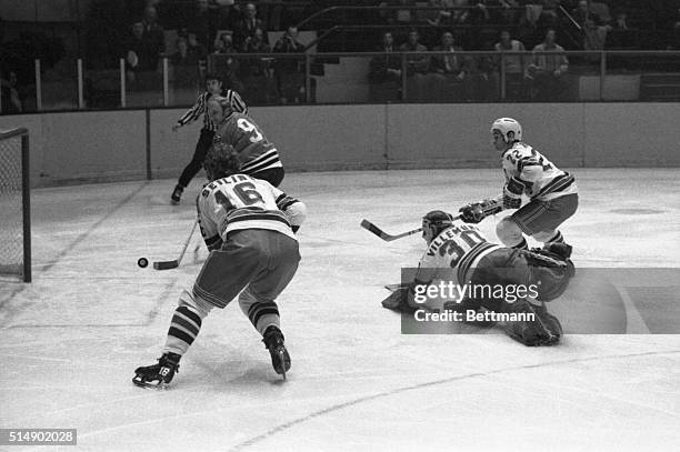 Chicago Black Hawks' Bobby Hull flips puck past Rangers' goalie Gilles Villemure to score first goal during their Stanley Cup game here, April 23rd.