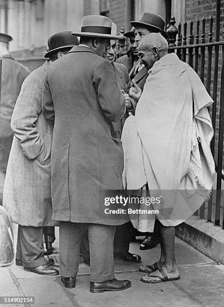 Mahatma Gandhi being interviewed in front of 10 Downing Street, London, after his conference with Prime Minister James Ramsey MacDonald.