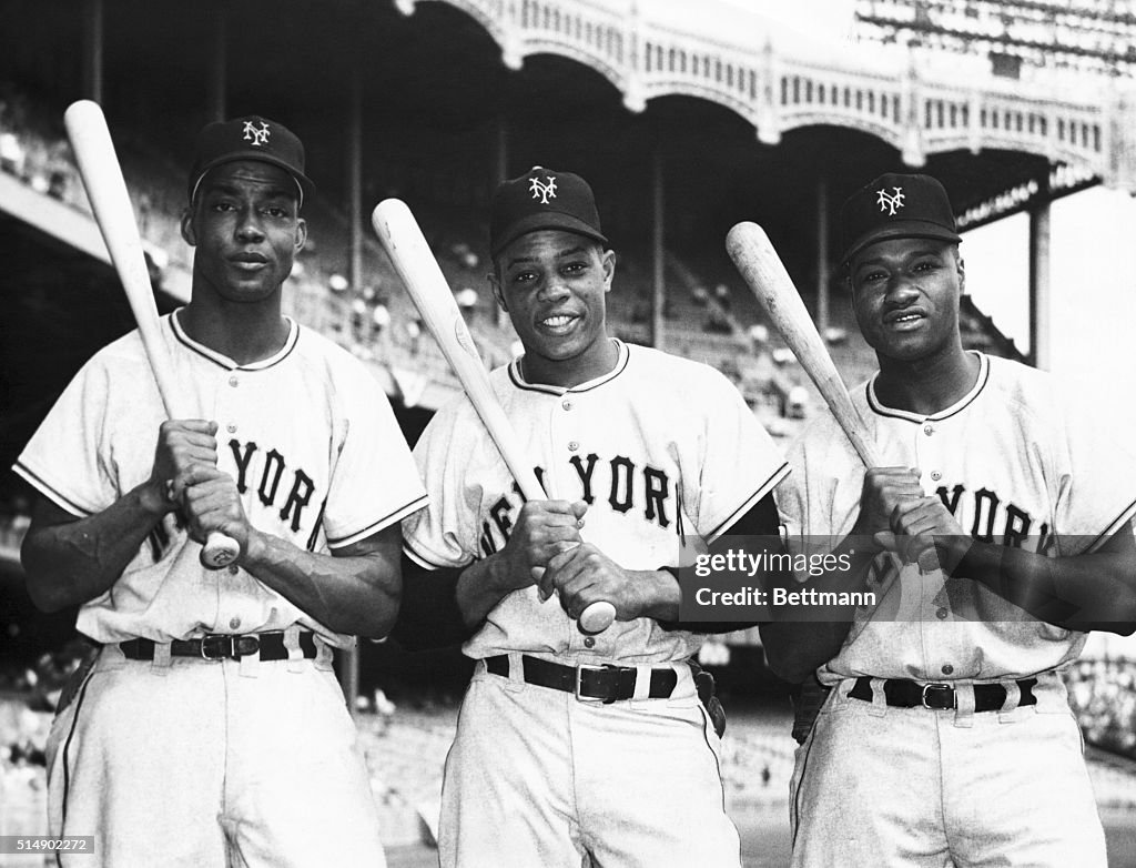 Baseball Sluggers Posing with Baseball Bats