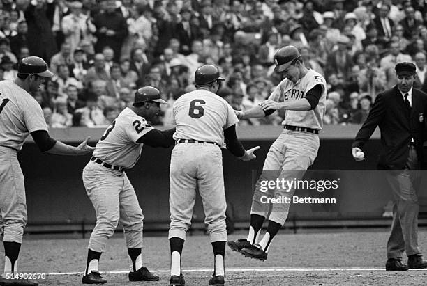 St. Louis, MO: Busch Stadium: Tiger Jim Northrup jumps on plate here after circling bases in second inning following his bases full homer in Tigers'...