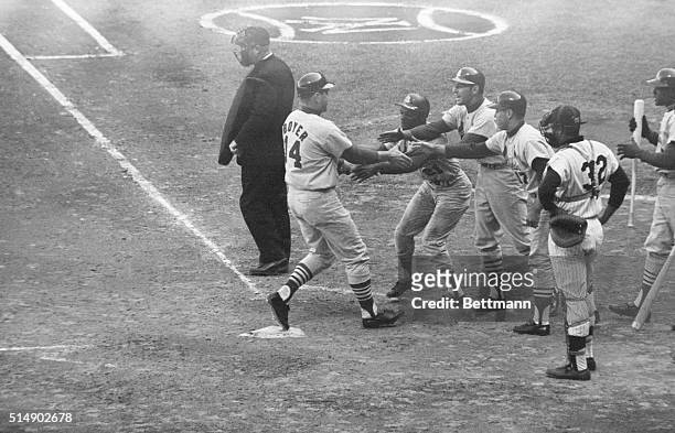 New York, NY: Ken Boyer of the St. Louis Cardinals gets a jubilant welcome from Curt Flood, Dick Groat and Carl Warwick, the three men he sent across...