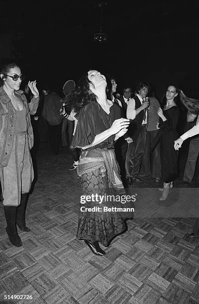 New York, NY: Margaret Trudeau, wife of Canada's Prime Minister Pierre Trudeau, does some fancy stepping at Studio 54, a New York City disco, during...