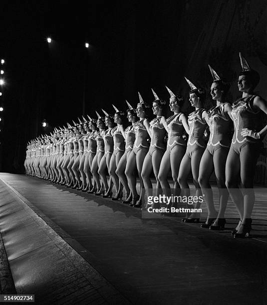 The Rockettes line up on the cavenous Radio City Music Hall stage.