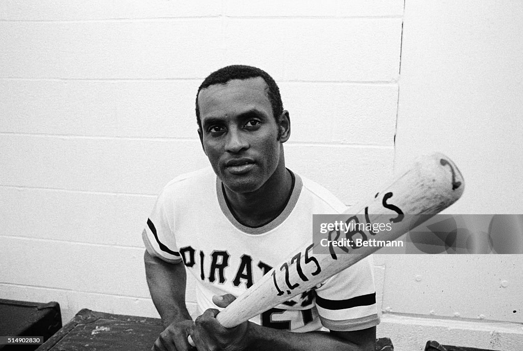 Roberto Clemente Holds Bat With RBI Statistic