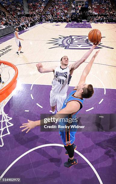 Kosta Koufos of the Sacramento Kings rebounds against Mitch McGary of the Oklahoma City Thunder on February 29, 2016 at Sleep Train Arena in...