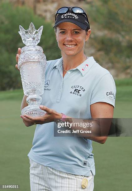 Annika Sorenstam of Sweden holds her trophy after winning the LPGA Samsung World Championship on October 17, 2004 at the Big Horn Golf Club in Palm...