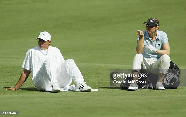 Annika Sorenstam of Sweden and caddie Terry McNamara wait for the group in front of them to putt on the 10th hole during the final round of the LPGA...