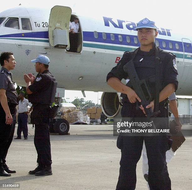 Chinese police arrive 17 October 2004 in Port-au-Prince from Beijing to reinforce the police component of the United Nations' peacekeeping mission in...