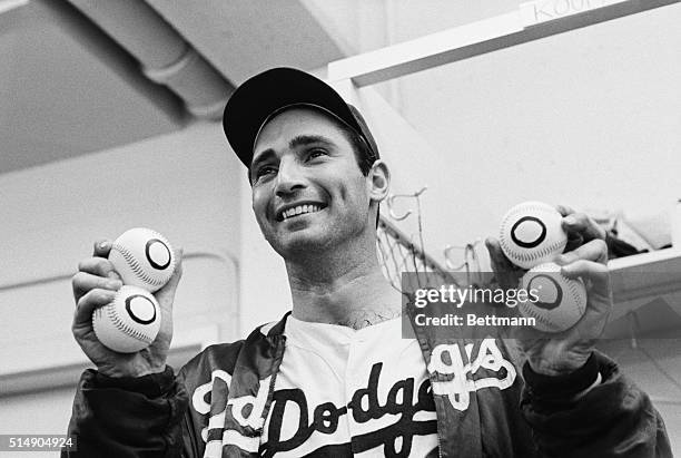 Chicago, IL: Los Angeles Dodger Sandy Koufax shows winning form as he throws during a game with the Chicago Cubs. Koufax struck out 18 Chicago Cubs...