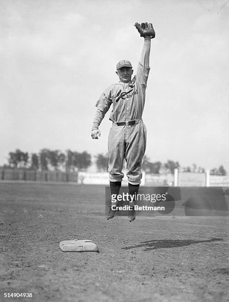 Avon Park, FL: Frankie Frisch, former captain of the New York Giants, goes after a high one as he practices at second base with the St. Louis...