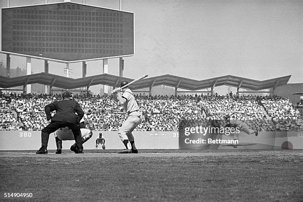 Los Angeles, CA: Los Angeles Dodgers' star southpaw pitcher Sandy Koufax throws the first pitch, a ball, in the fourth game of the World Series. At...