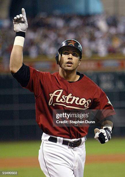 Carlos Beltran of the Houston Astros celebrates after hitting the game winning home run against the St. Louis Cardinals in game four of National...