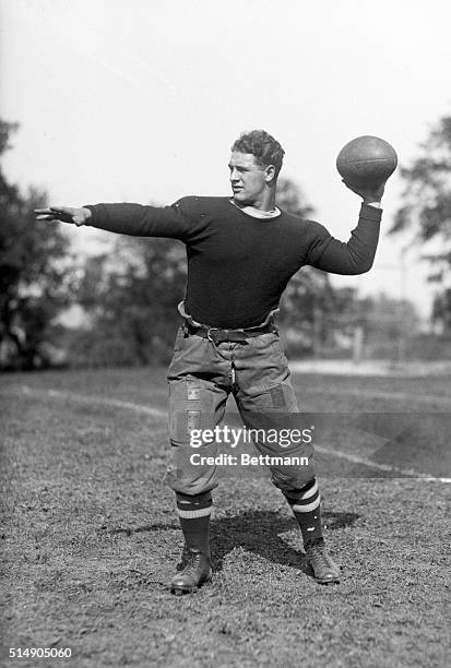 Portrait of Columbia University halfback Lou Gehrig posing in passing stance.