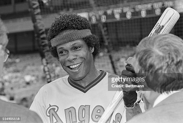 New York, NY: You might say that that hair styling and that smile make California Angels' Rod Carew look most angelic July 23rd at Yankee Stadium,...