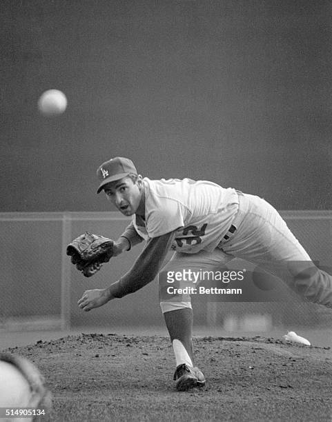 Minneapolis, MN: The big gun for the Dodgers in the 1965 World Series is Sandy Koufax, and here he lets go one of his best during the last game of...