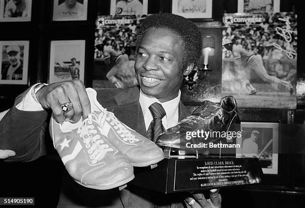 New York, NY: St. Louis Cardinals' Lou Brock, the greatest base-stealer in the history of modern baseball, stops here enroute to spring training to...