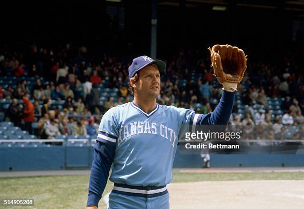Closeups of George Brett, Kansas City Royals baseball player, throwing baseball.