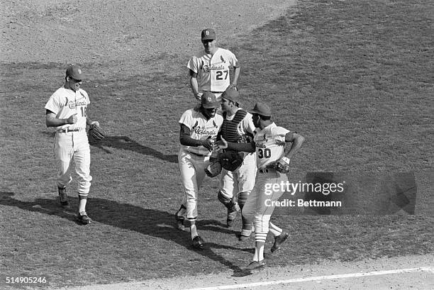 St. Louis, MO: A new World Series under his belt brings a big smile to Cardinal pitcher Bob Gibson as he leaves the field after fanning his 17th...