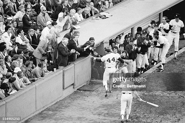 Boston, MA: Reggie Jackson is congratulated by Yankees owner George Steinbrenner and Yanks Vice-President Al Rosen after belting a home run in the...