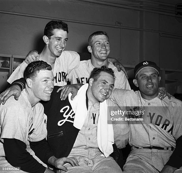 New York, NY: Yankee heroes of the 11-7 victory over the Dodgers in the fifth game of the 1953 World Series rejoice in the dressing room after the...