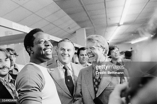 Atlanta, Georgia: Governors Jimmy Carter of Georgia and Sherman Tribbitt of Delaware draw a big laugh from Braves' slugger Hank Aaron as they visit...