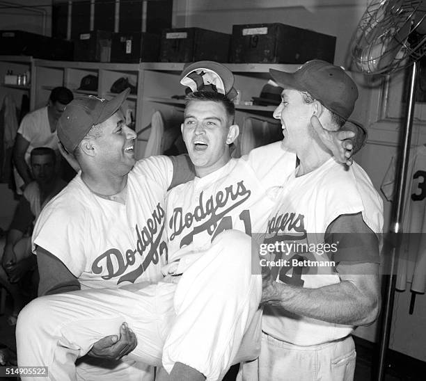 New York, NY: One of the many happy scenes in the Dodger dressing room after they copped a twin bill against the Pirates today and moved into...