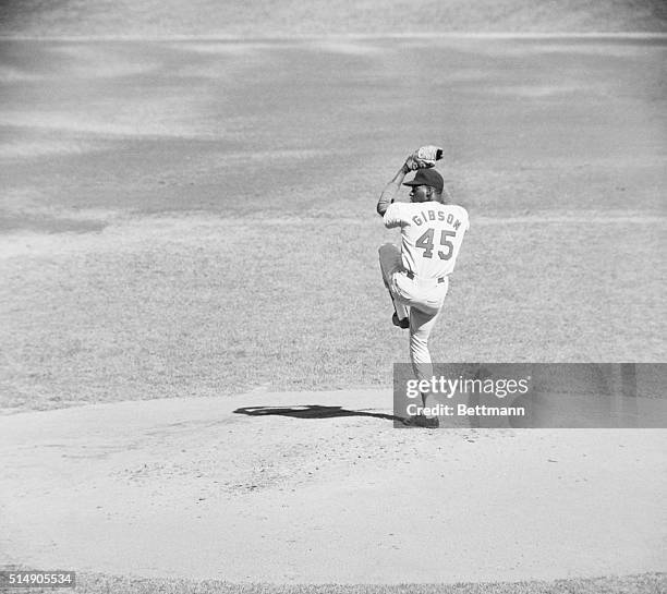 New York, NY: Action shot of St. Louis Cardinals' Bob Gibson pitching in the fifth game of the World Series against the Yankees.