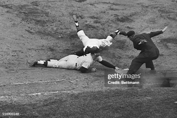 Forbes Field, PA: Yankee Mickey mantle dives back to the bag to prevent a double play in the 9th inning after Yogi Berra hit to Pirate 1st baseman...