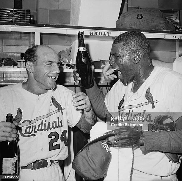 St. Louis, MO: Happiest of the happy Cardinals are pitcher Bob Gibson , dripping with champagne, and Dick Groat, shortstop, after the Cards won the...