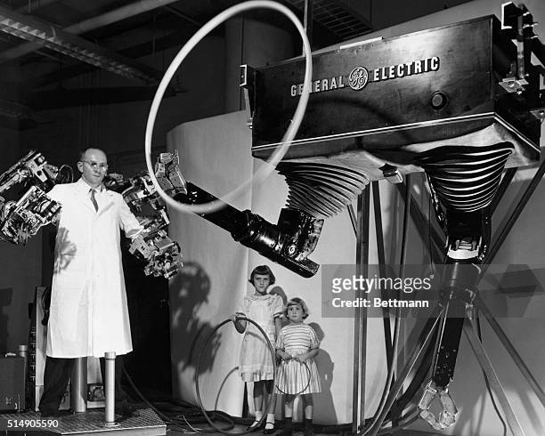 Schenectady, NY: Developed by the General Electric engineering lab, this hydro-mechanical masterslave "Handyman" represents mankind's closest...