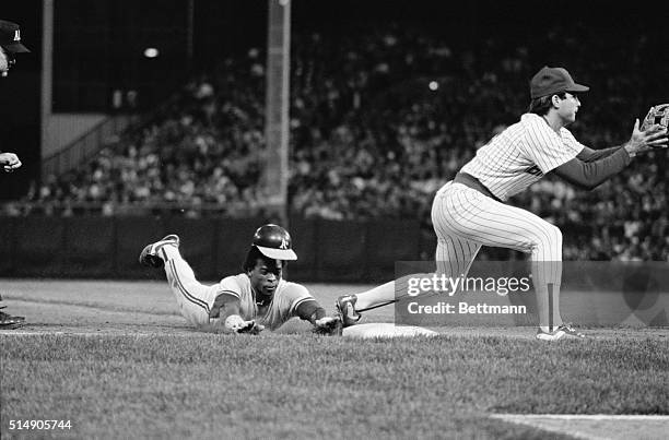 Milwaukee, WI: Oakland A's Rickey Henderson loses his hat as he steals third base in the eigth inning of the A's-Milwaukee Brewers game. Henderson...