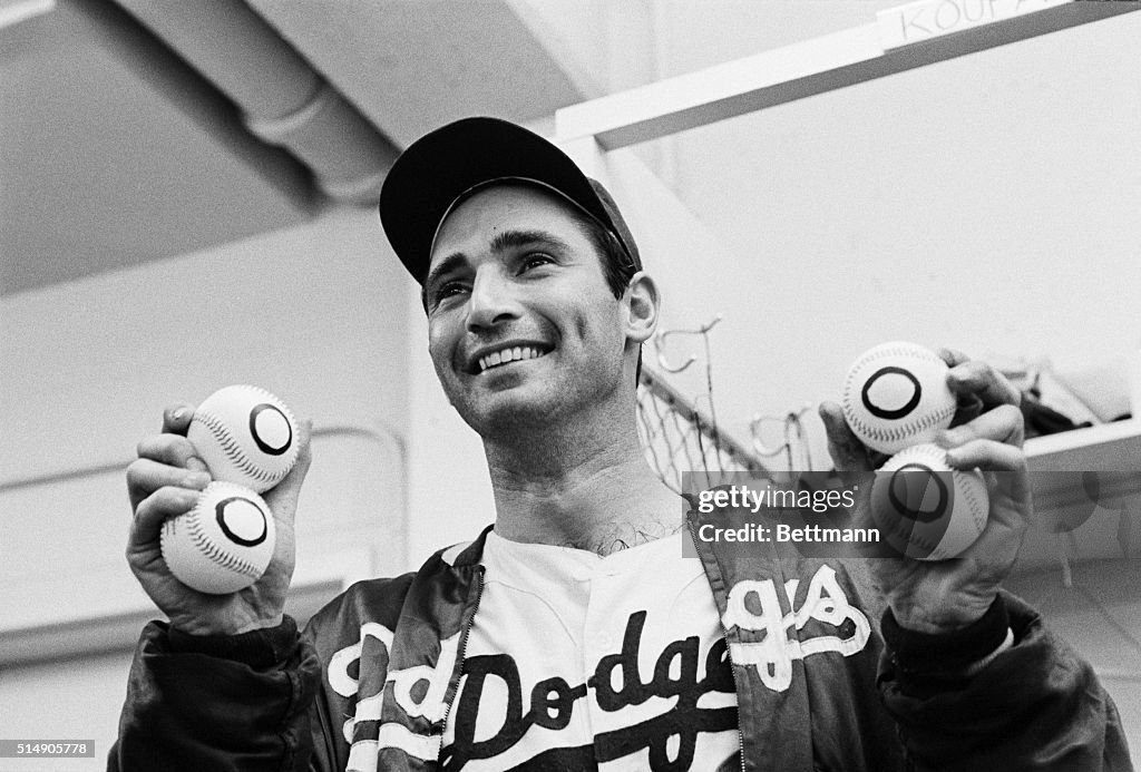 Sandy Koufax Holding 4 "Zero" Baseballs