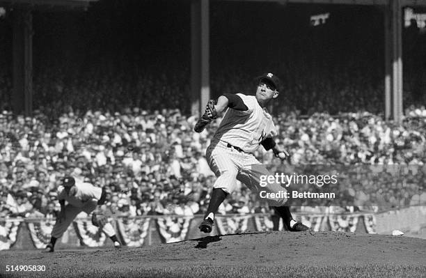 New York, NY: Yankee Stadium- New York Yankees' pitcher Whitey Ford is pictured in action against the Milwaukee Braves in the first game of the World...