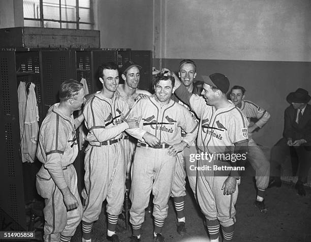 New York, NY: Max Lanier,popular St. Louis Cardinal hurler,is surrounded by teammates after the Cardinals had scored their third victory over the New...