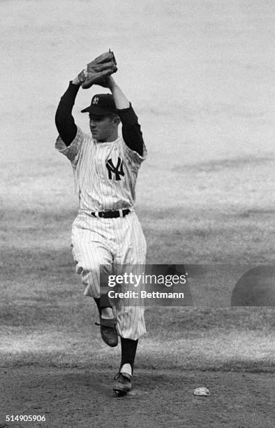 New York, NY: Ed "Whitey" Ford is shown pitcing for the New York Yankees in their fourth game of the World Series against the Philadelphia Phillies.
