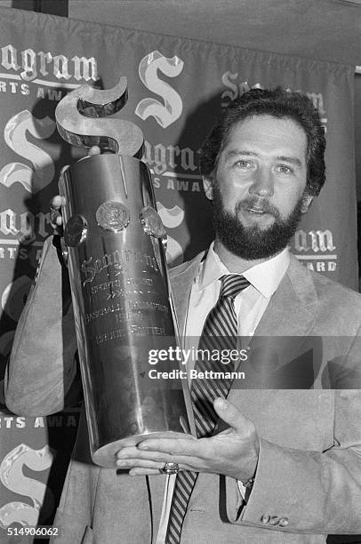 New York, NY St. Louis Cardinals' relief pitcher Bruce Sutter holds the Seagram's trophy presented to him as the 1984 Baseball Player of the Year.
