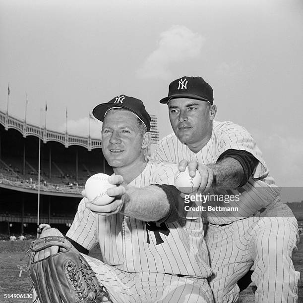 Portrait of New York Yankees' pitcher Whitey Ford, sixteen game winner, and relief pitcher Luis Arroyo. Arroyo came into relief in 9 of Ford's 16...
